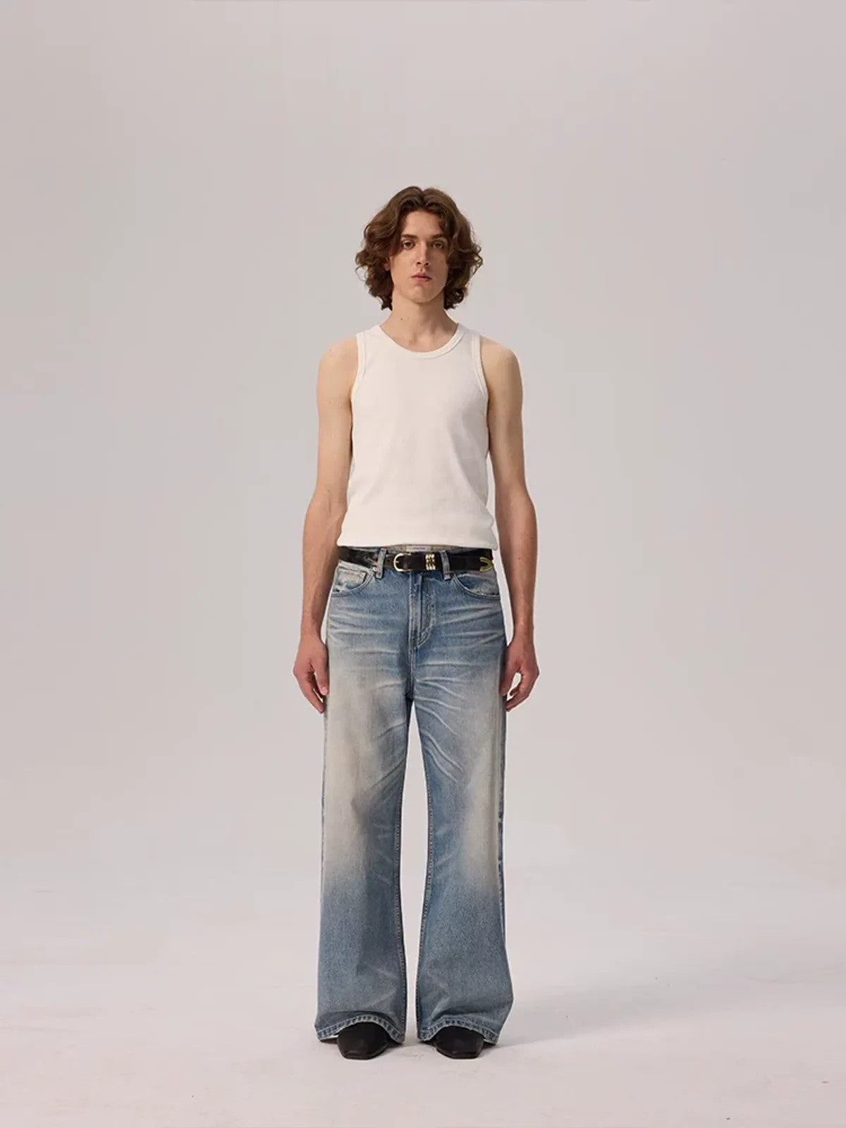 AFterTaste Distressed Whiskered Light Wash Jeans in Blue - On Model