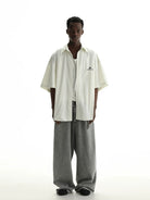 MASONPRINCE Distressed Cotton Short Sleeve Shirt in White - On Model