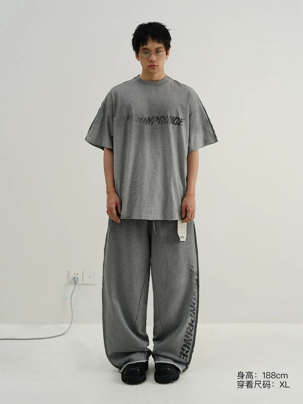 MASONPRINCE Distressed Spray Paint Logo Tee in Gray - On Model