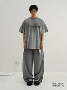 MASONPRINCE Distressed Spray Paint Logo Tee in Gray - On Model