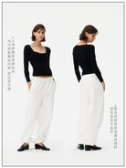 Fax Copy Express Wide U Neck Snap Button Top in Black - On Model