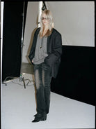 ACSENSE STUDIO Whiskered Micro Flare Jeans in Black - On Model