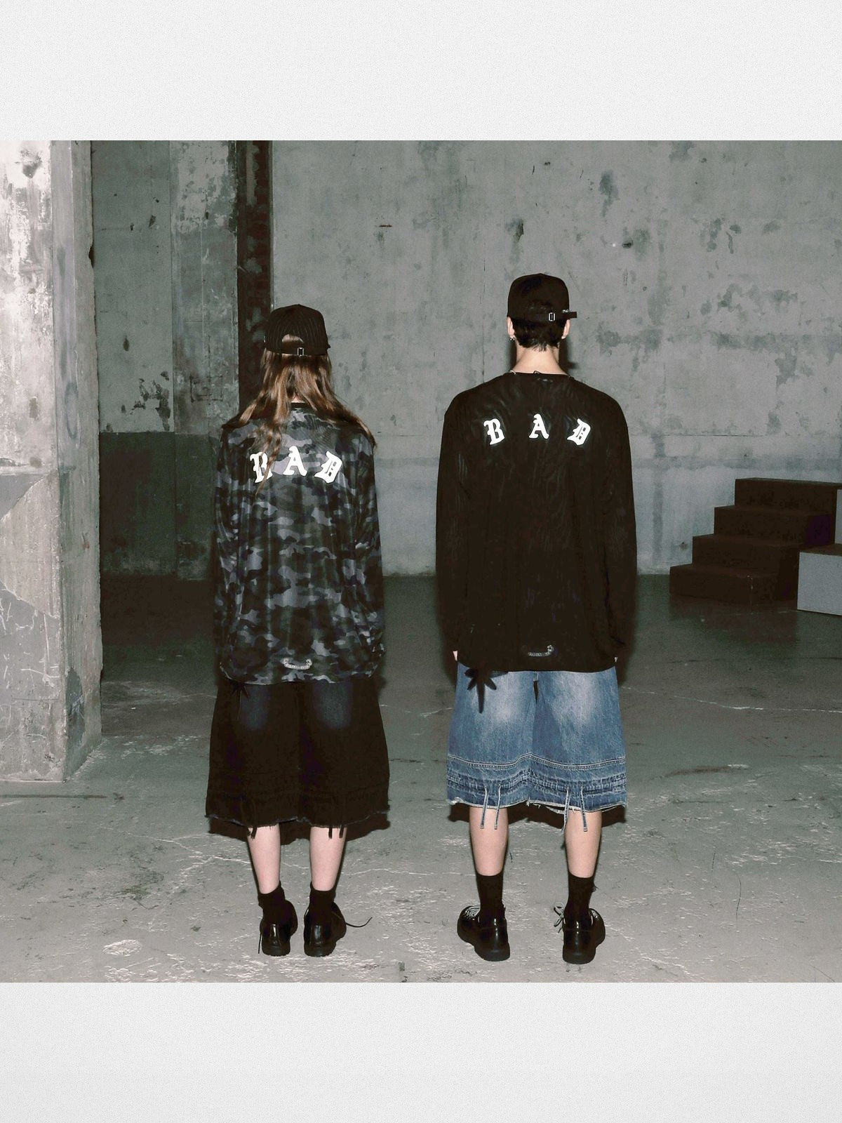 BADSEED Distressed Denim Bermuda Shorts in Medium Blue - On Model