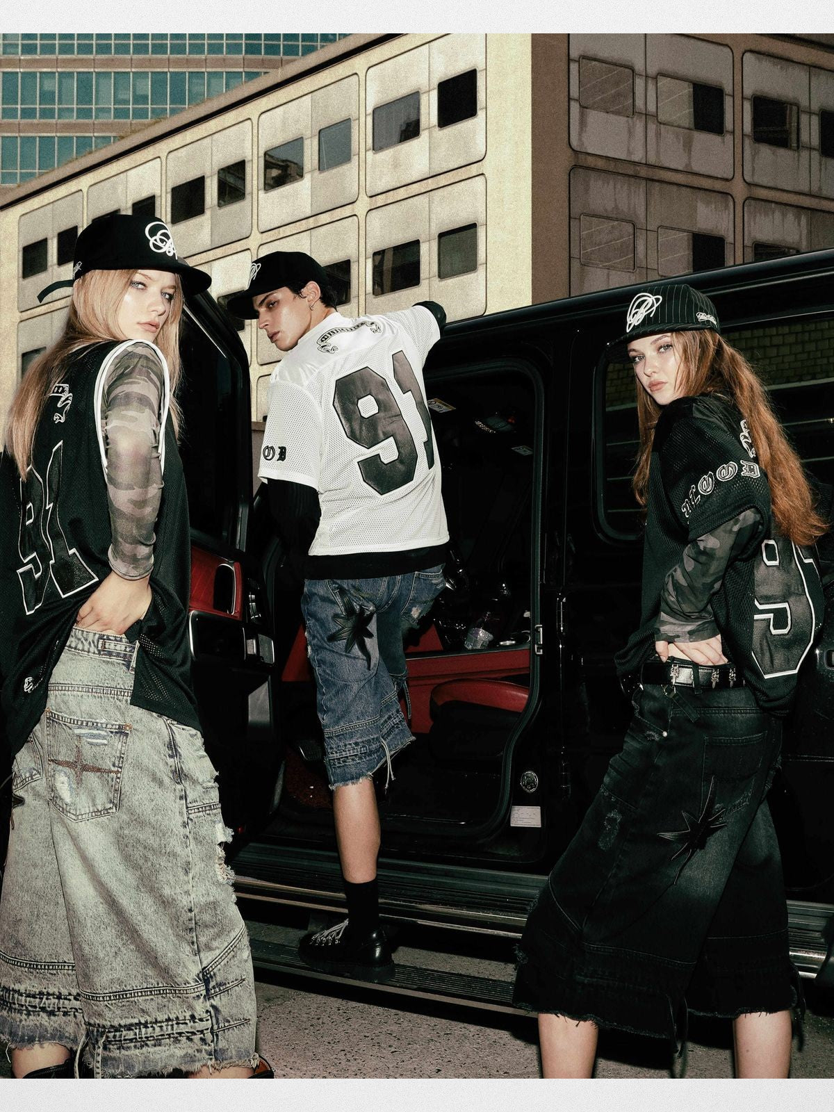 BADSEED Distressed Denim Bermuda Shorts in Medium Blue - On Model