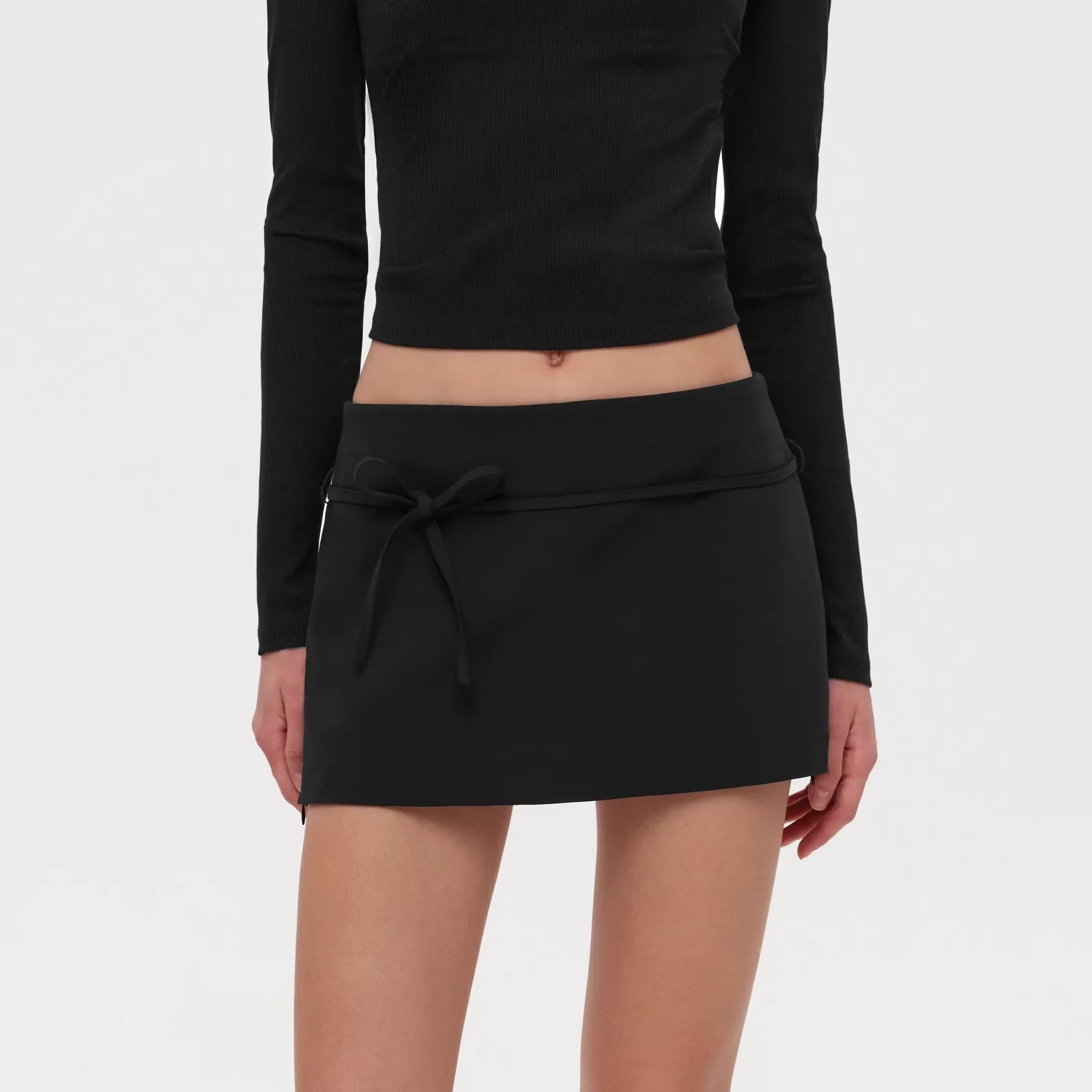 PUKI Vintage Low-Waist Mini Skirt with Detachable Bow and Lace-Up Detail